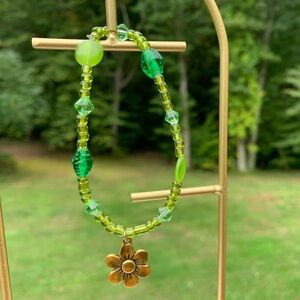 Handmade Green Beaded Bracelet With A Gold Flower Charm🌼